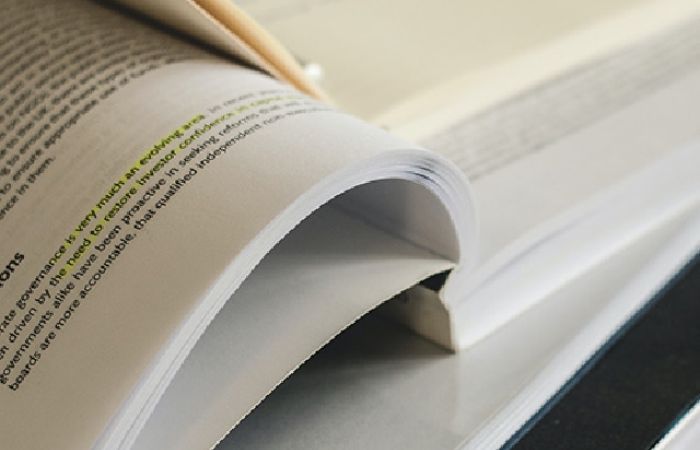 Open book with yellow highlighted text